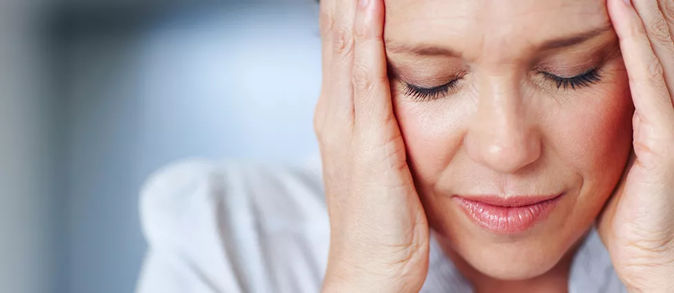 Woman experiencing jaw pain